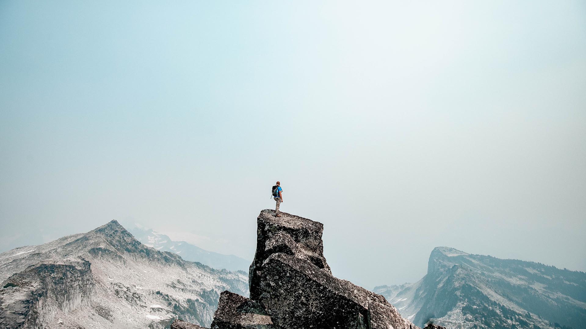 Hiker standing on mountain peak